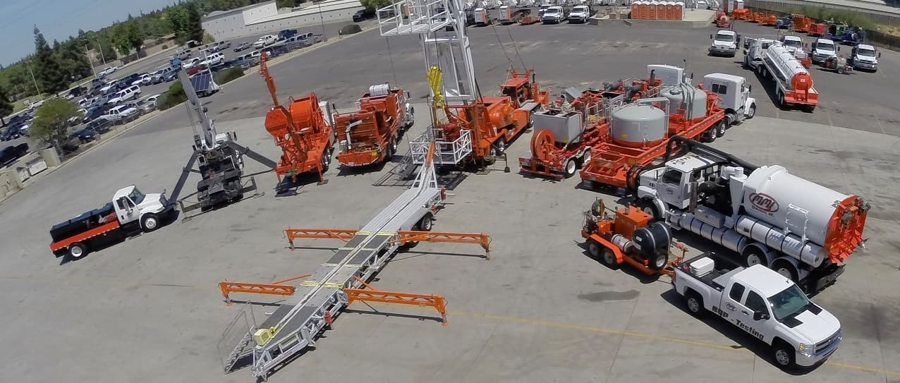 Aerial view of an MMI Services well location in the Kern County oilfield